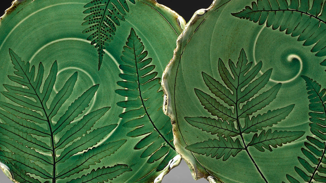 Ceramics artist Ellen Grenadier's leaf green plates show the patterns of fern fronds in her studio in Monterey. Press photo courtesy of the artist