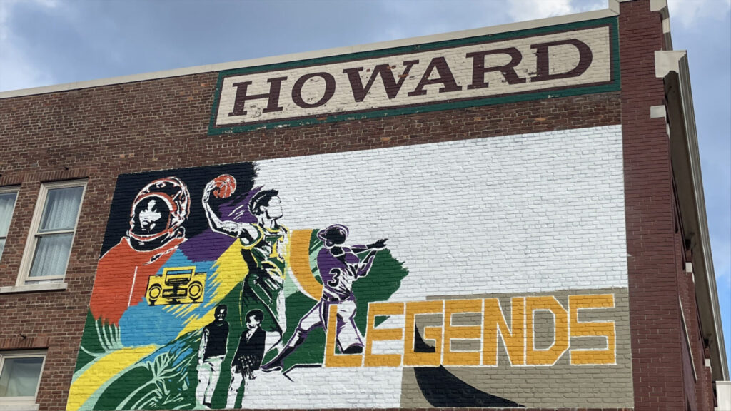 Young Legends, a mural by Trinity Rivard, takes shape on the Howard Building on Federal Street in Pittsfield, with astronauts and athletes.