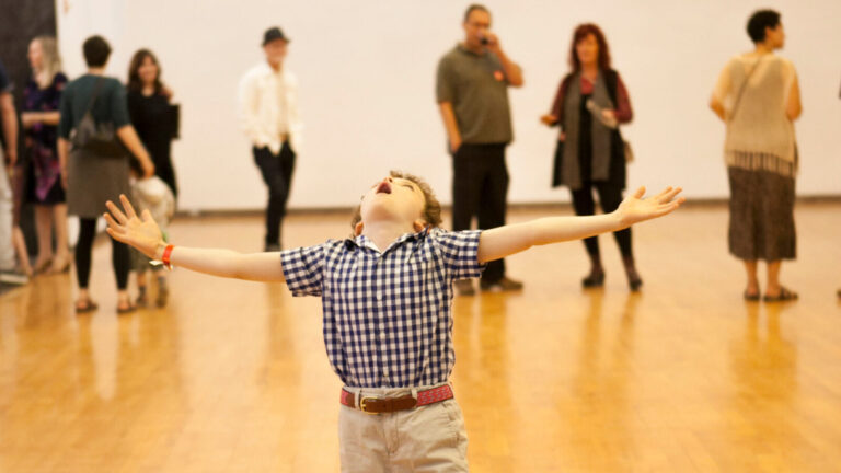 A young visitor gazes at artwork high in the galleries at Mass MoCA. Press photo courtesy of the museum