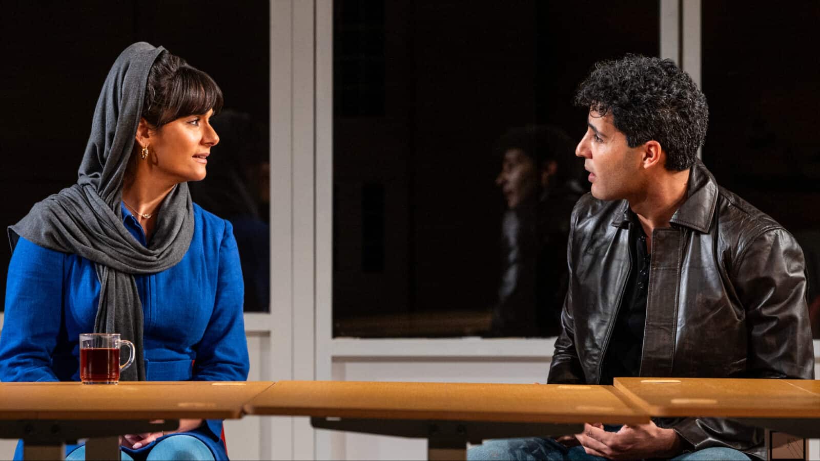 Nazanin Nour as the teacher, Marjan, talks with Babak Tafti as Omid, a student in her office hours in a city classroom at night, in Sanaz Toossi's play 'English' at Barrington stage. Press photo courtesy of BSC