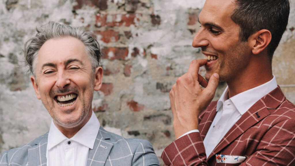 Alan Cumming (Cabaret, The Good Wife) and Ari Shapiro (NPR’s All Things Considered, Pink Martini) laugh together. Press photo courtesy of the Mahaiwe