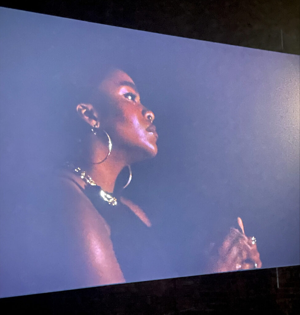 A woman sings in a tribute to both Black American and Scots ancestors in Simone Bailey's work in Like Magic at Mass MoCA.