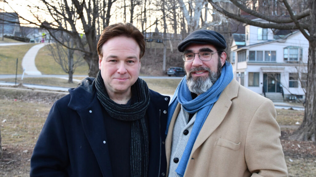 Williams College professors Edan Dekel and Jeffrey Israel stand together near a sycamore on Southworth Street in Williamstown on a winter day. Press photo courtesy of the artists