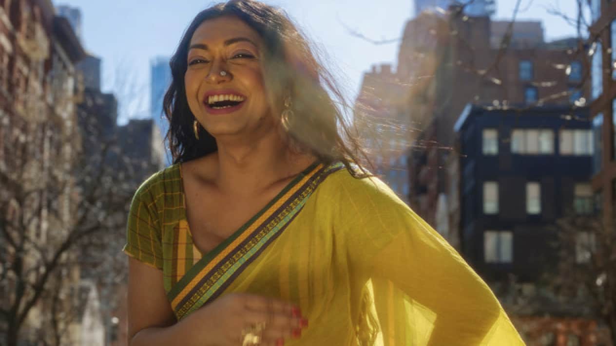 Tashnuva Anan laughs in vivid sunlight in New York City. Press photo courtesy of the '62 Center at Williams College