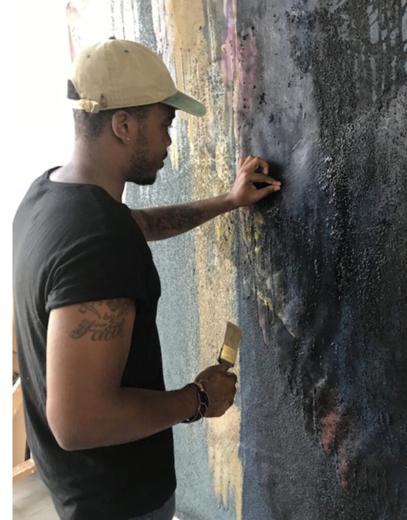 Abstract painter Patrick Eugène works on a canvas as a James Weldon Jonson artist fellow at Bard College at Simon's Rock. Press photo courtesy of the college