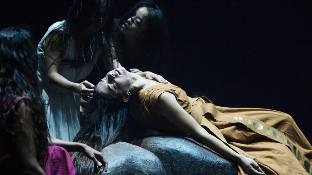 Elpida Skourou lies prone as Akram Khan Company performs Thikra. Press photo courtesy of Jacob's Pillow
