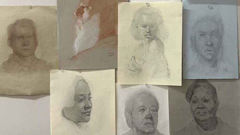 Figure drawings by Arthur Fredericks line a wall in sunlight. Photo courtesy of the artist