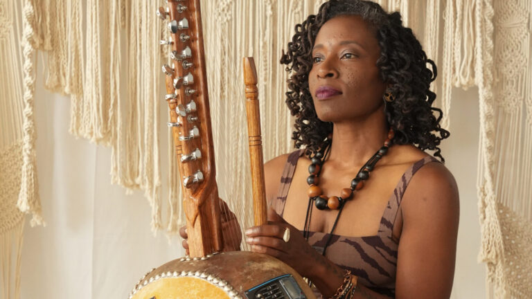 Tanee Osborne holds a melody on the kora as KaJe Movement Collective offers a live performance and ceremonial work celebrating the resilience, joy, and sisterhood of Black women across the diaspora. Press photo courtesy of the artists