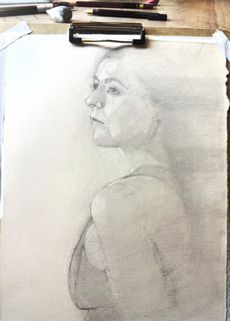 A figure drawing of a woman by Arthur Fredericks loks out of the page of a sketch pad. Photo courtesy of the artist.