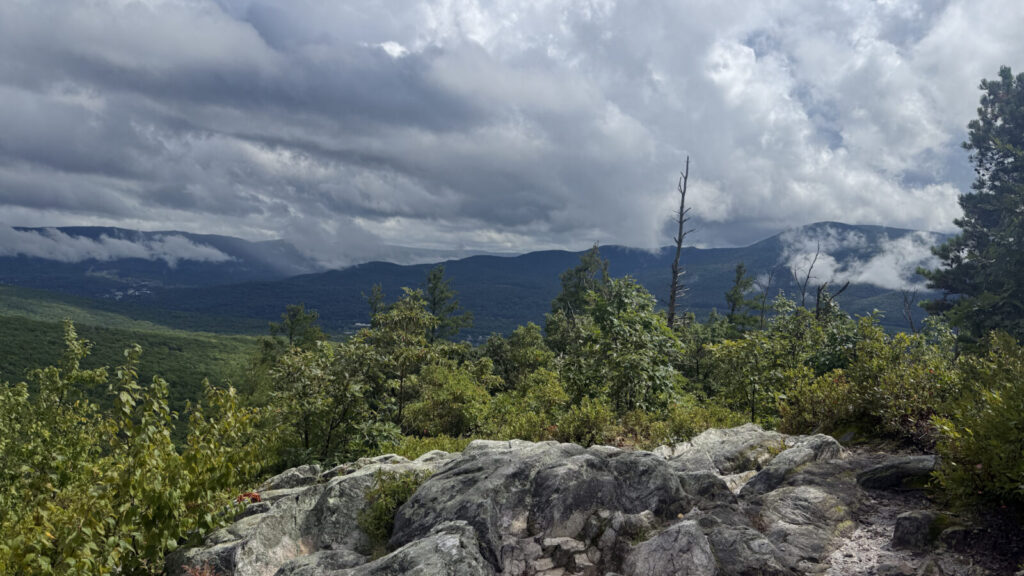 From the summit of Pine Cobble, rain shows as mist on the far ridges.