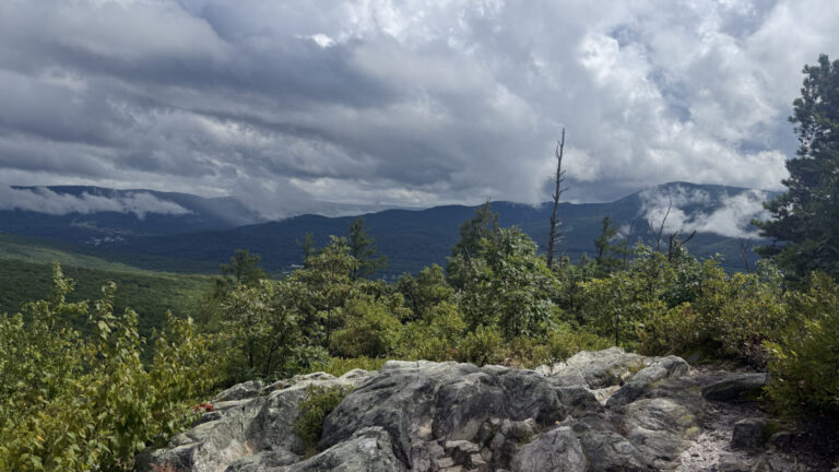 From the summit of Pine Cobble, rain shows as mist on the far ridges.